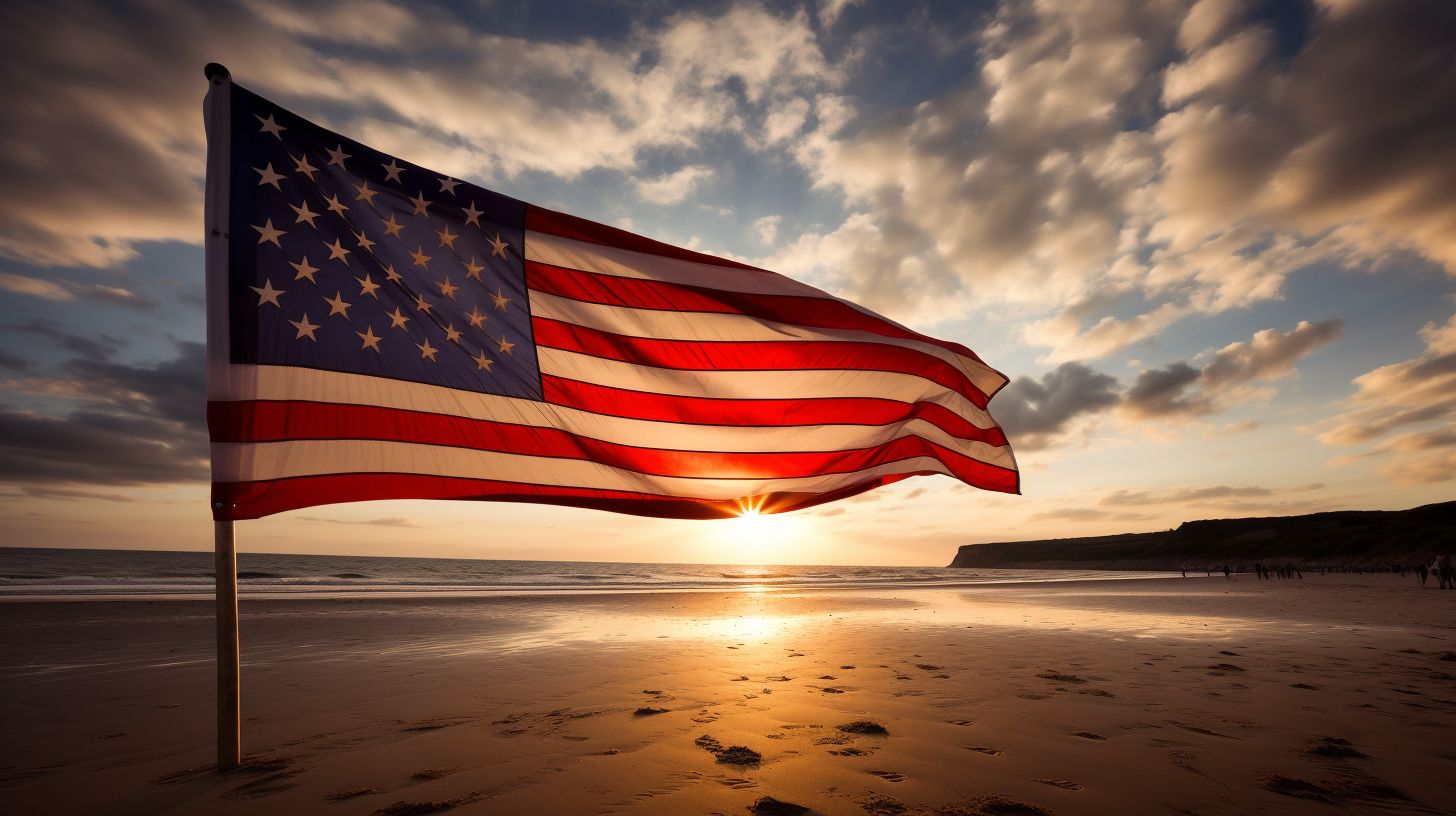 A wide-angle view of an American flag on Omaha Beach at sunset.